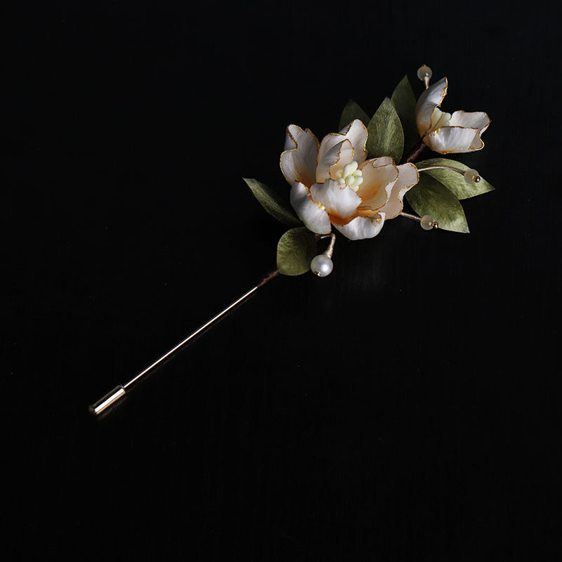 Golden Peony Brooch on black background